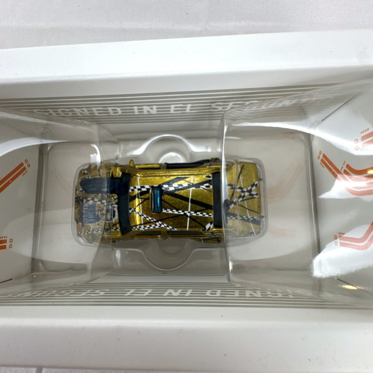 Hot Wheels id Time Attaxi 1:64 scale diecast car in metallic gold with original packaging