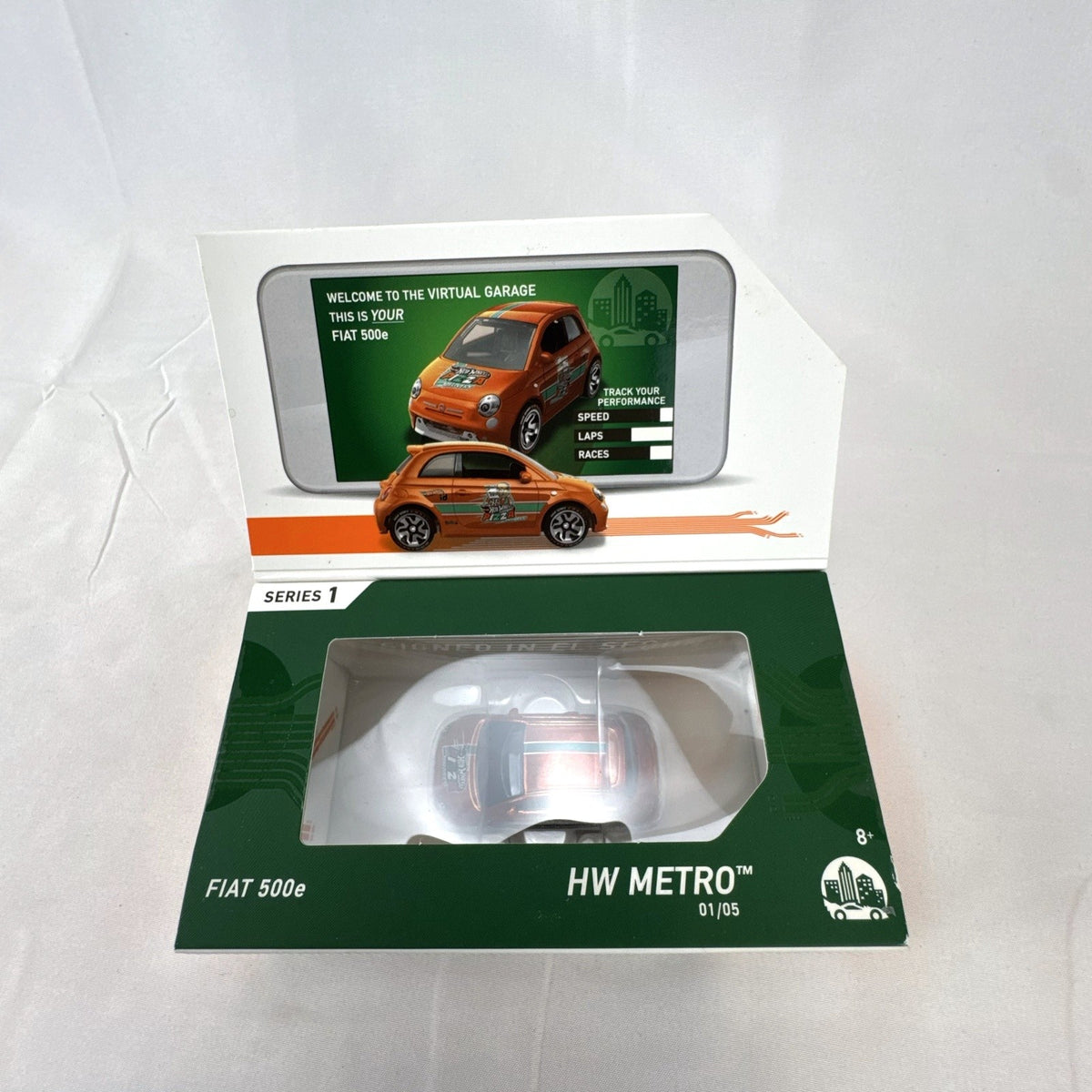Hot Wheels id 1:64 scale Fiat 500e diecast car in metallic orange pizza delivery livery