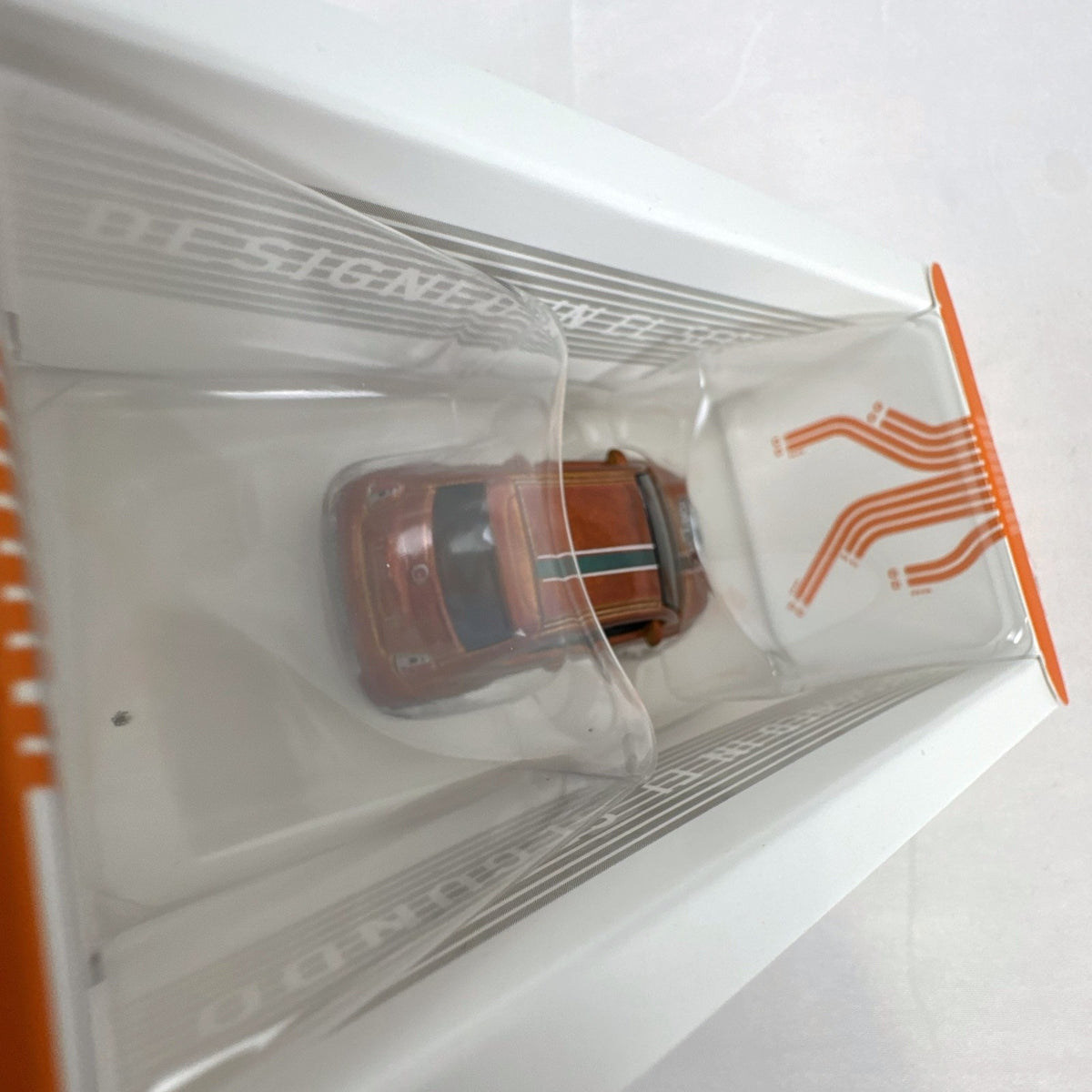 Hot Wheels id 1:64 scale Fiat 500e diecast car in metallic orange pizza delivery livery