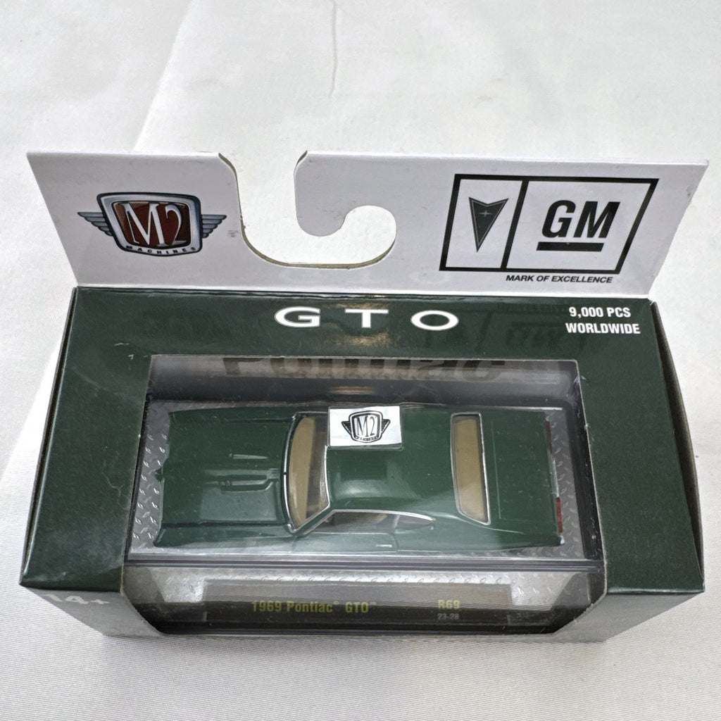M2 Machines 1:64 scale 1969 Pontiac GTO diecast car in green, factory sealed in acrylic display case