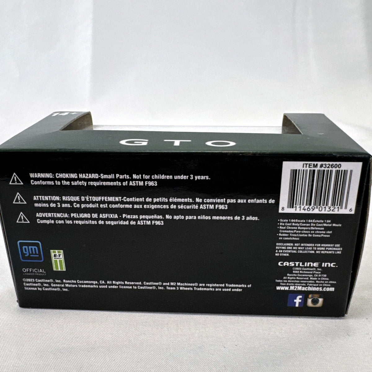 M2 Machines 1:64 scale 1969 Pontiac GTO diecast car in green, factory sealed in acrylic display case