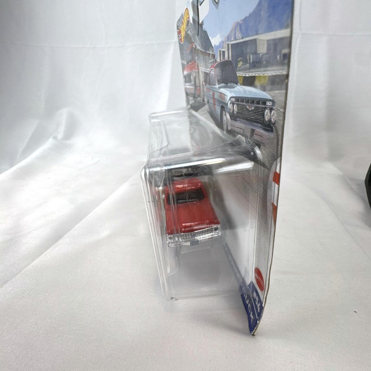 Hot Wheels Team Transport 1:64 scale '61 Chevy Impala and '72 Ramp Truck diecast set in sealed blister packaging