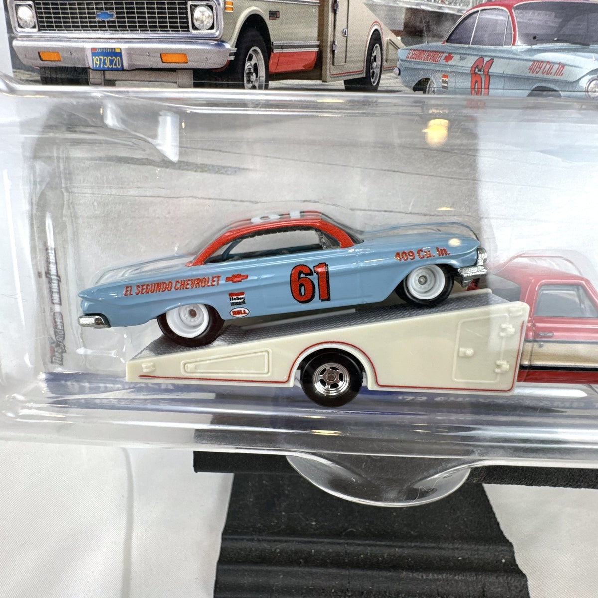 Hot Wheels Team Transport 1:64 scale '61 Chevy Impala and '72 Ramp Truck diecast set in sealed blister packaging