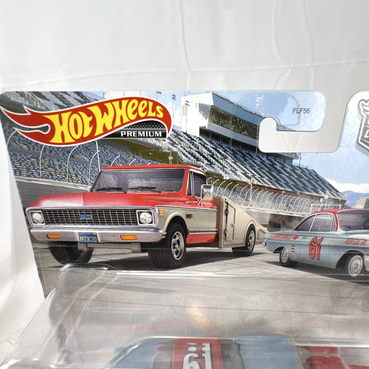 Hot Wheels Team Transport 1:64 scale '61 Chevy Impala and '72 Ramp Truck diecast set in sealed blister packaging