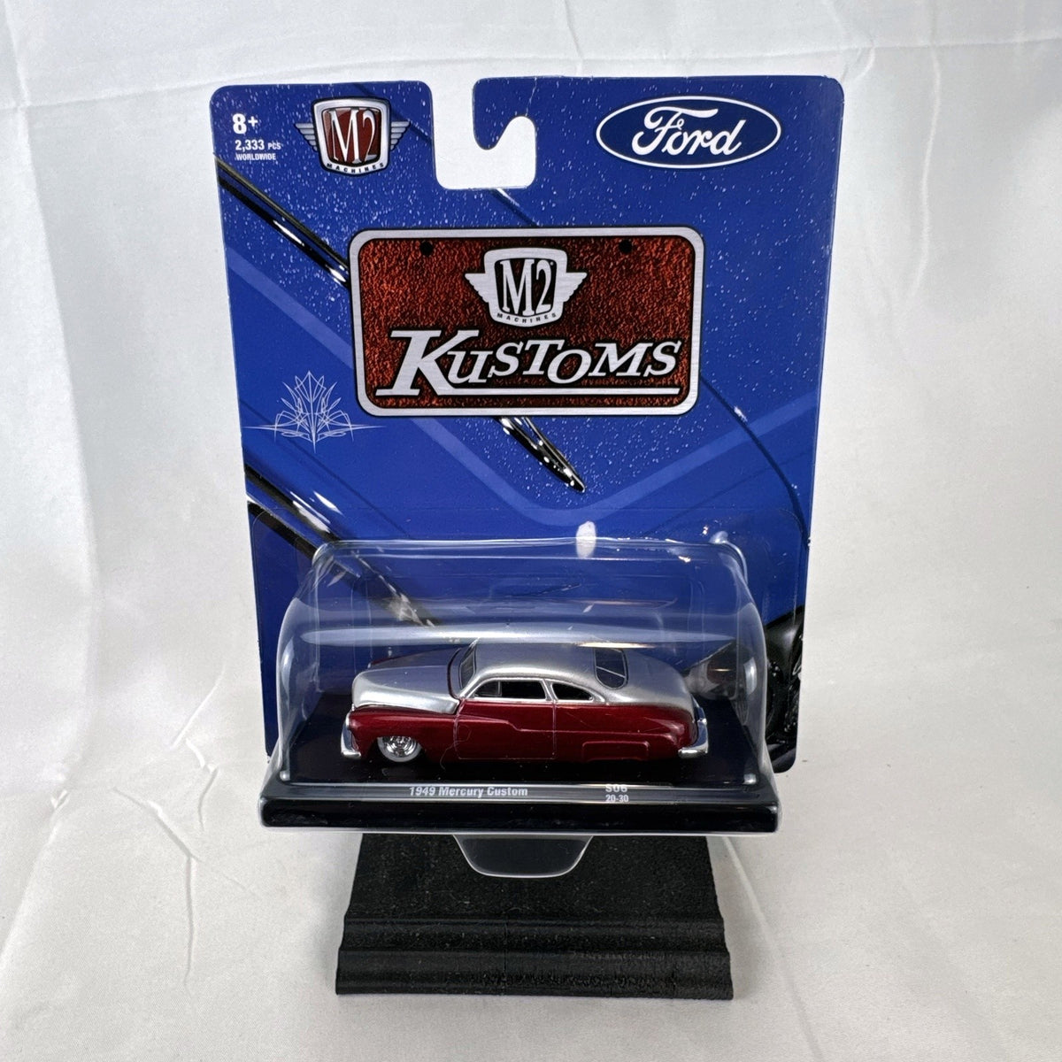 M2 Machines 1:64 scale 1949 Mercury Custom diecast car in metallic red and silver