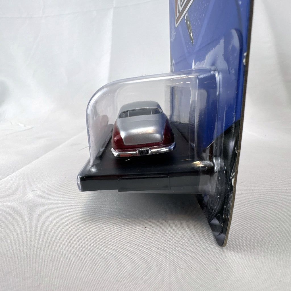 M2 Machines 1:64 scale 1949 Mercury Custom diecast car in metallic red and silver