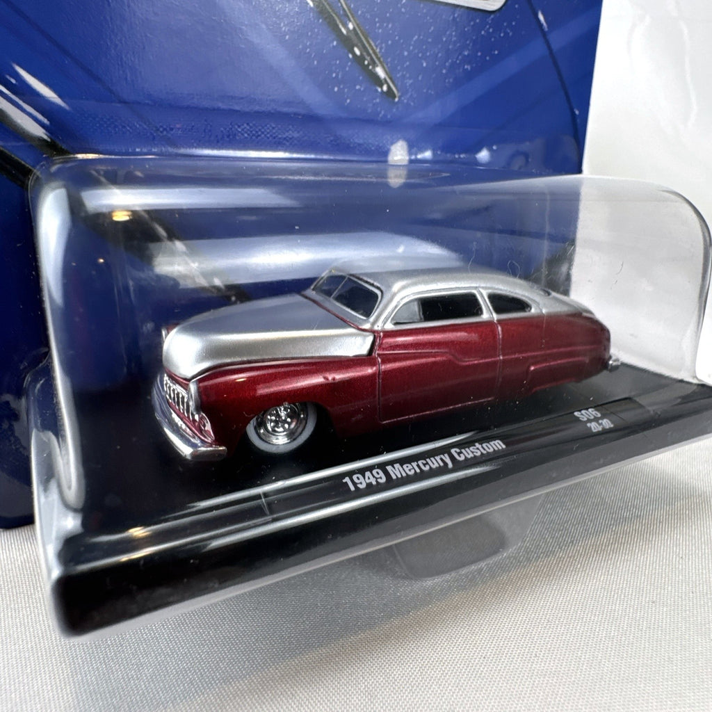 M2 Machines 1:64 scale 1949 Mercury Custom diecast car in metallic red and silver