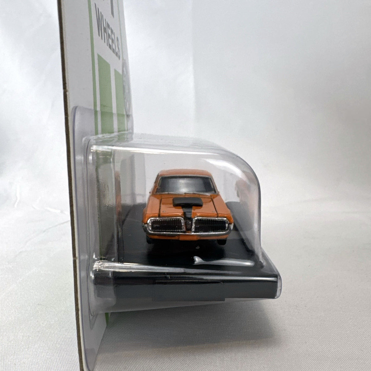 M2 Machines 1:64 scale 1968 1/2 Mercury Cougar R-Code diecast car in orange with ET Mags livery in sealed packaging