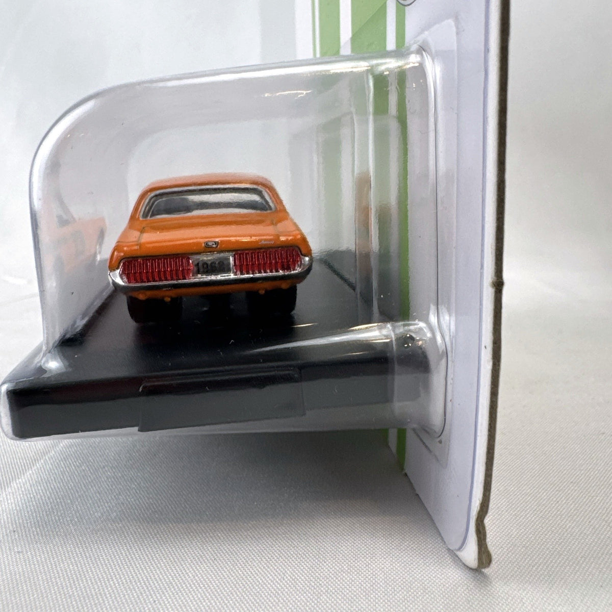 M2 Machines 1:64 scale 1968 1/2 Mercury Cougar R-Code diecast car in orange with ET Mags livery in sealed packaging
