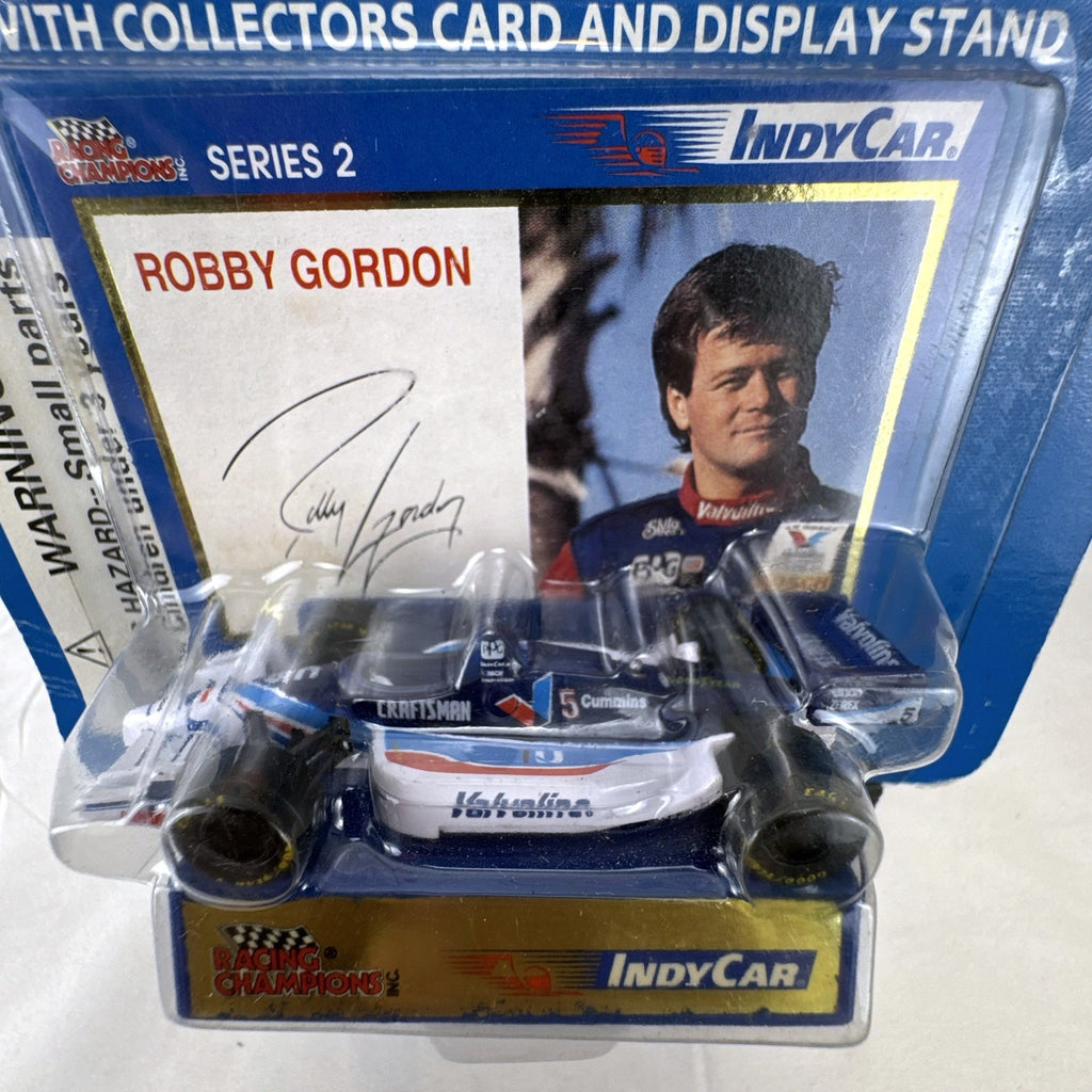 Racing Champions 1:64 diecast Robby Gordon #5 Valvoline IndyCar in factory-sealed blister pack with display stand