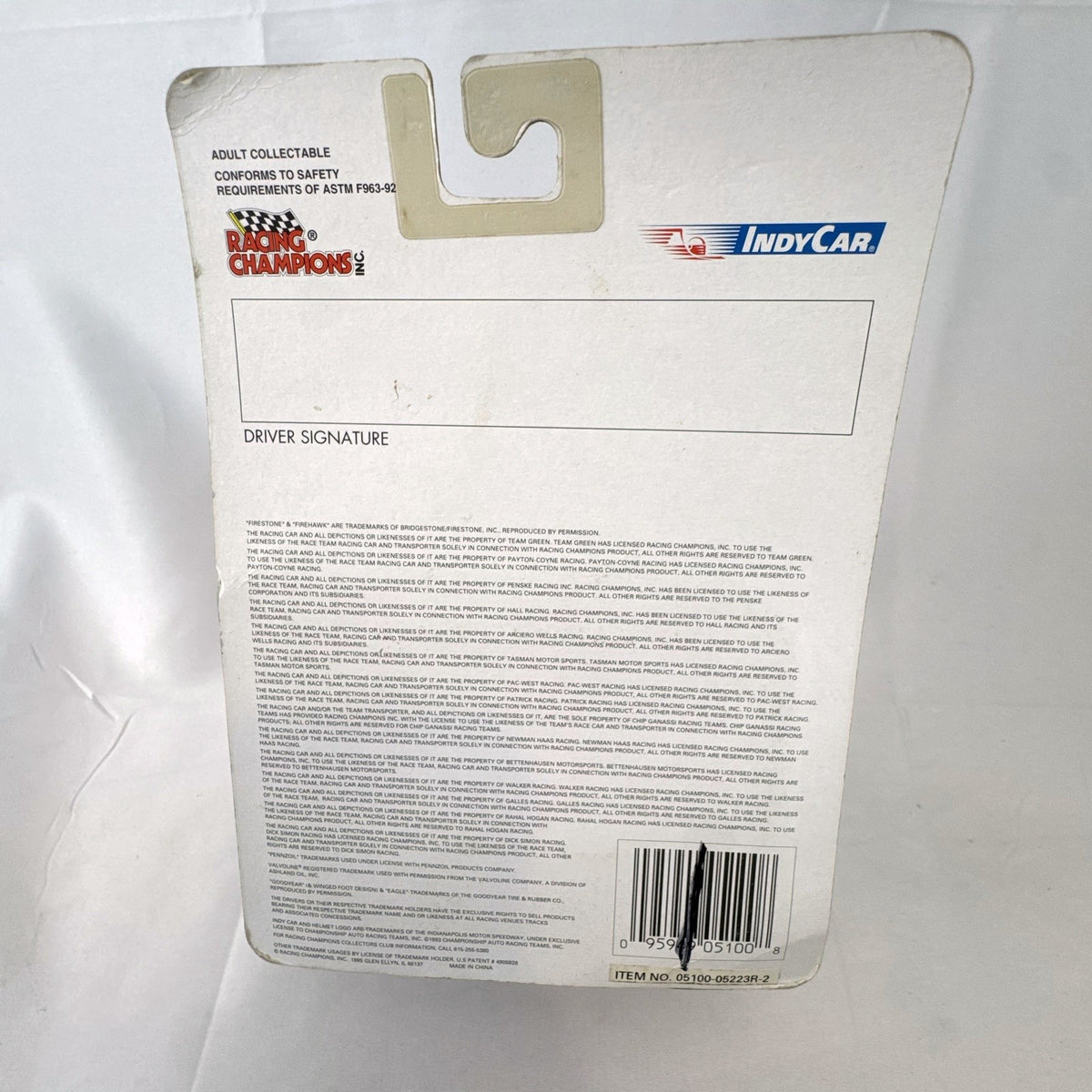 Racing Champions 1:64 diecast Robby Gordon #5 Valvoline IndyCar in factory-sealed blister pack with display stand