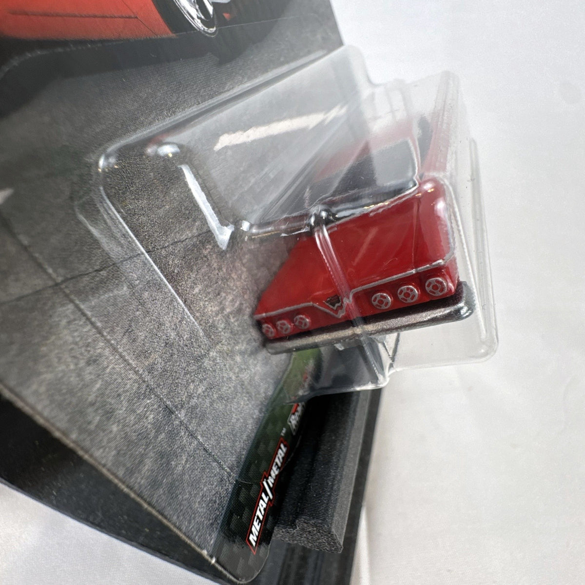 Hot Wheels Fast & Furious 1961 Chevrolet Impala 1:64 diecast car in gloss red with Real Riders tires in packaging.