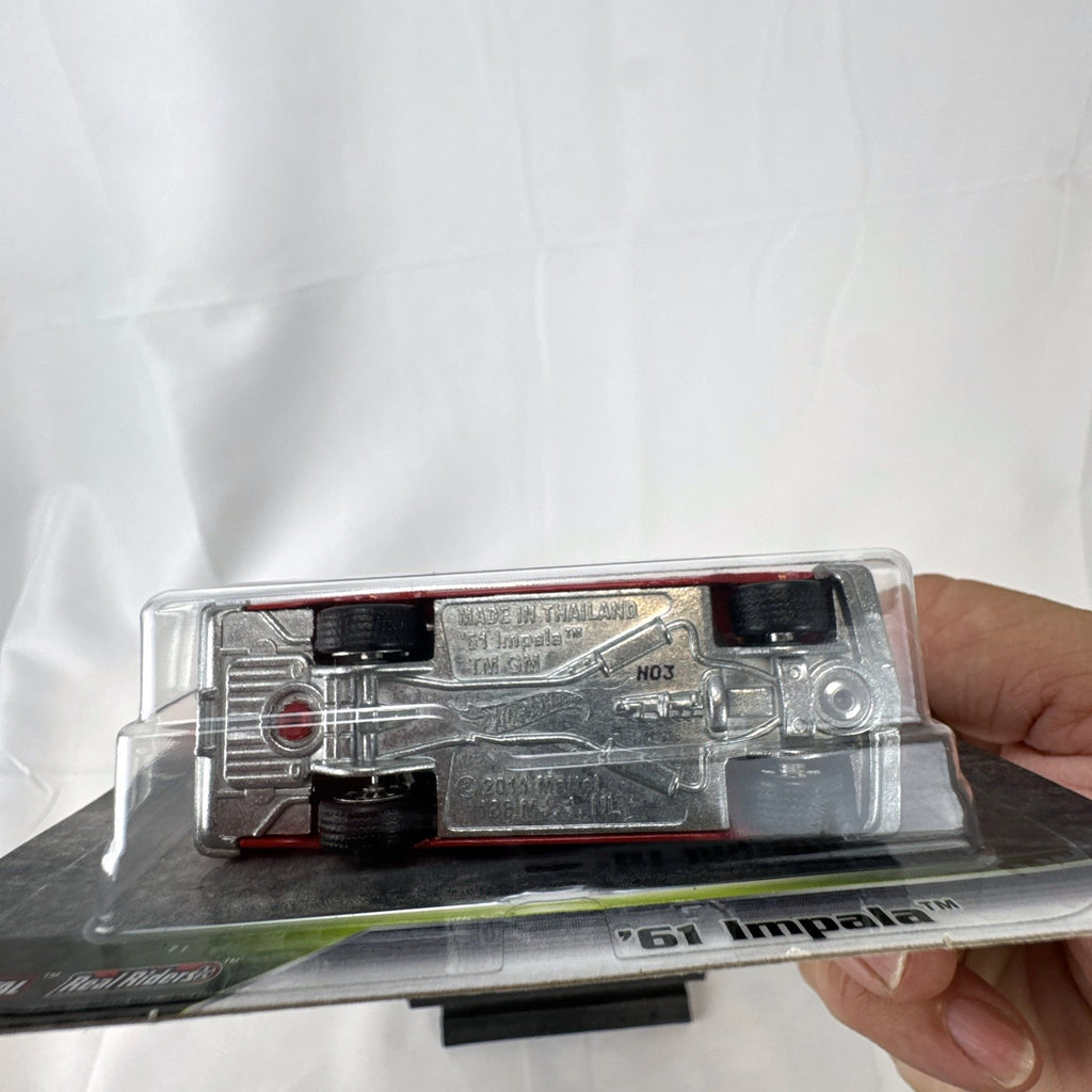 Hot Wheels Fast & Furious 1961 Chevrolet Impala 1:64 diecast car in gloss red with Real Riders tires in packaging.