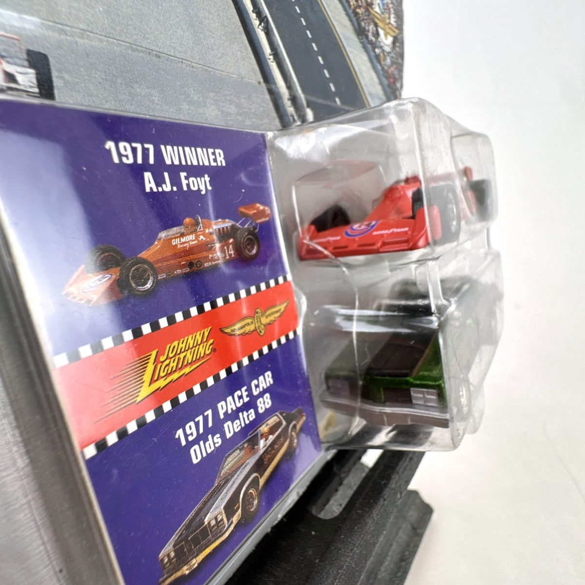 Johnny Lightning 1:64 scale 1977 Indy 500 set featuring AJ Foyt Gilmore racer and Oldsmobile Delta 88 pace car