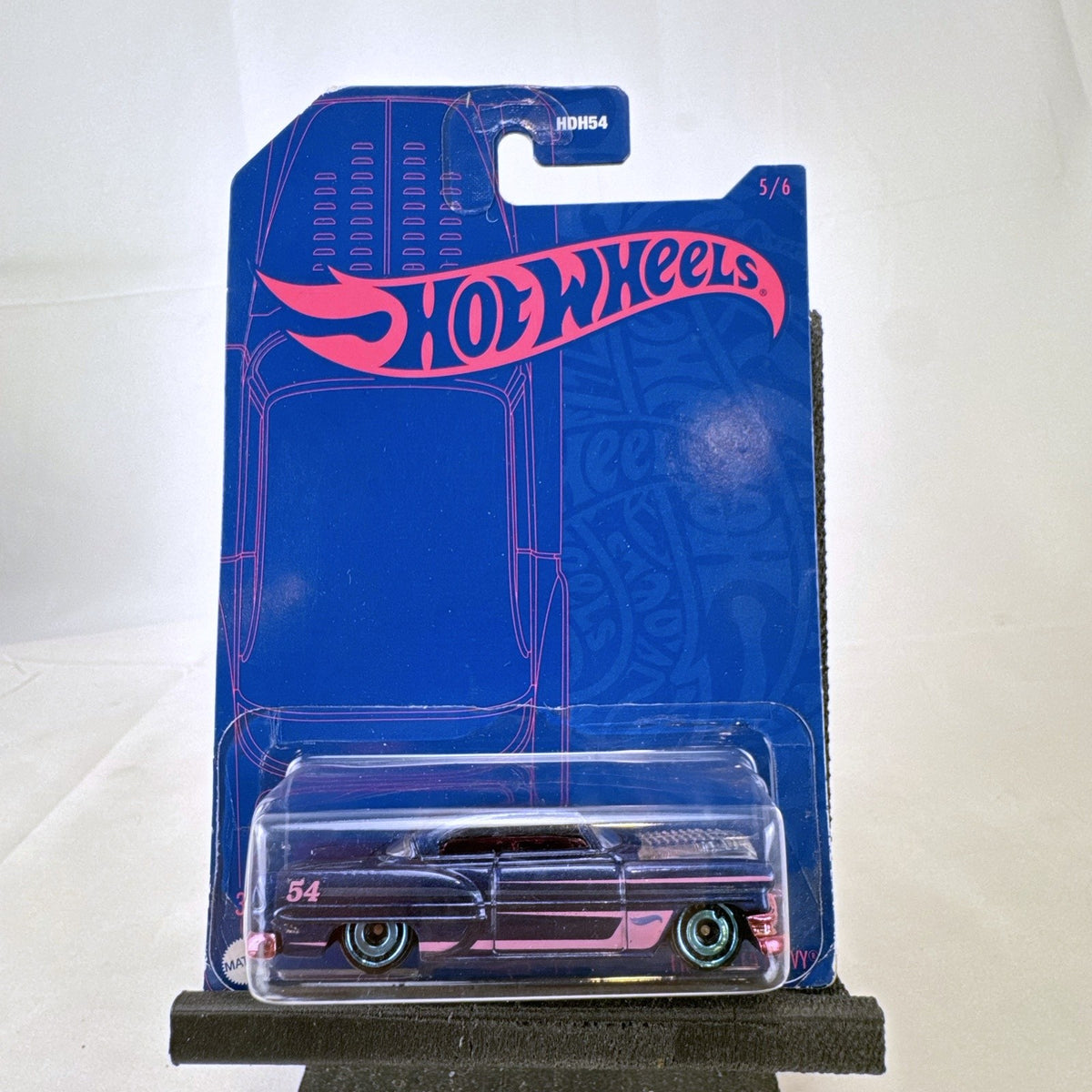 Sealed Hot Wheels 54th Anniversary Custom '53 Chevy 1:64 scale diecast car in metallic blue with pink graphics