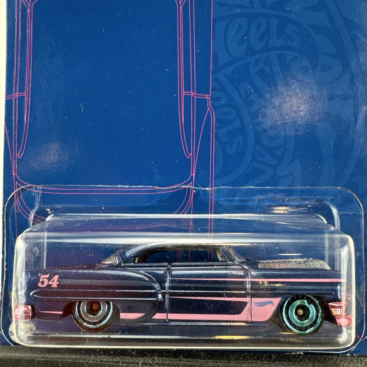 Sealed Hot Wheels 54th Anniversary Custom '53 Chevy 1:64 scale diecast car in metallic blue with pink graphics