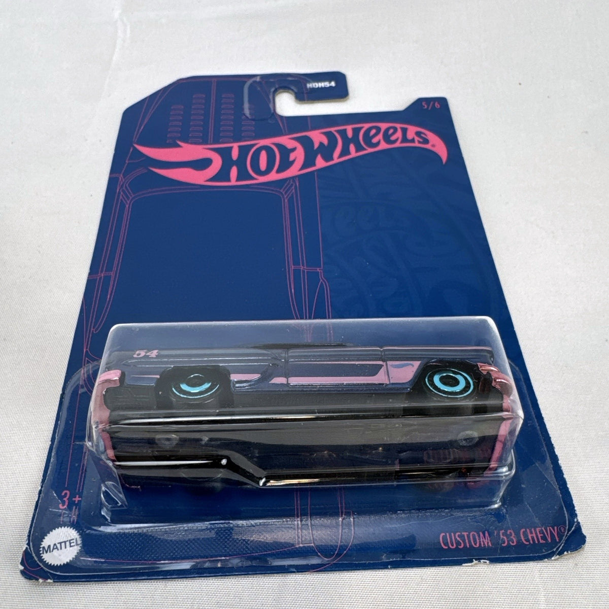 Sealed Hot Wheels 54th Anniversary Custom '53 Chevy 1:64 scale diecast car in metallic blue with pink graphics