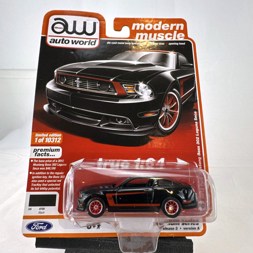 Auto World 1:64 scale 2012 Ford Mustang Boss 302 Laguna Seca diecast car in black with red accents in original packaging