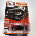 Auto World 1:64 scale 2012 Ford Mustang Boss 302 Laguna Seca diecast car in black with red accents in original packaging