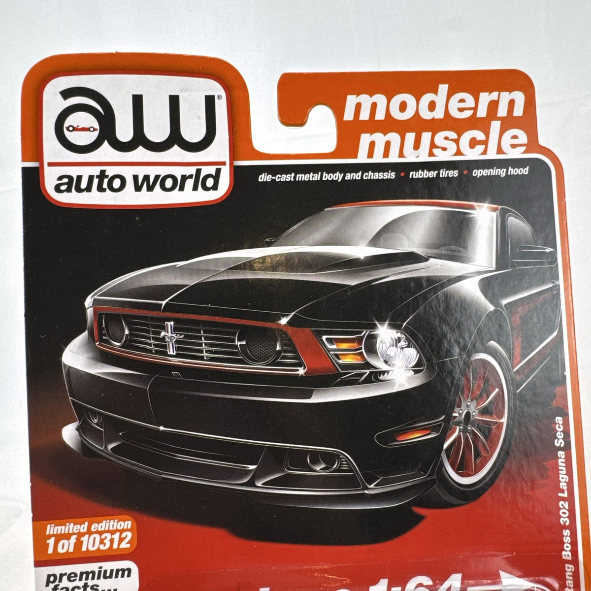 Auto World 1:64 scale 2012 Ford Mustang Boss 302 Laguna Seca diecast car in black with red accents in original packaging