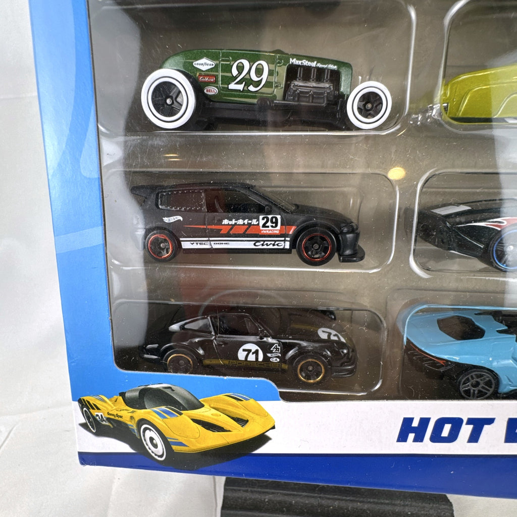 Hot Wheels 1:64 scale 8-car multipack in box featuring exclusive gold Nissan Skyline HT 2000GT-X