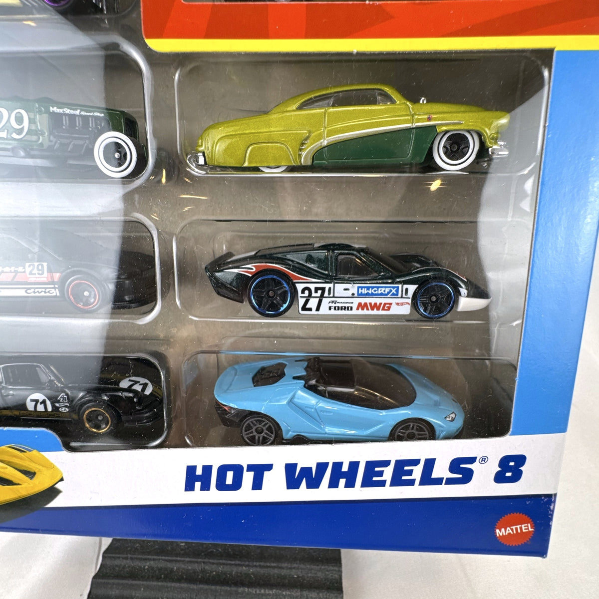 Hot Wheels 1:64 scale 8-car multipack in box featuring exclusive gold Nissan Skyline HT 2000GT-X