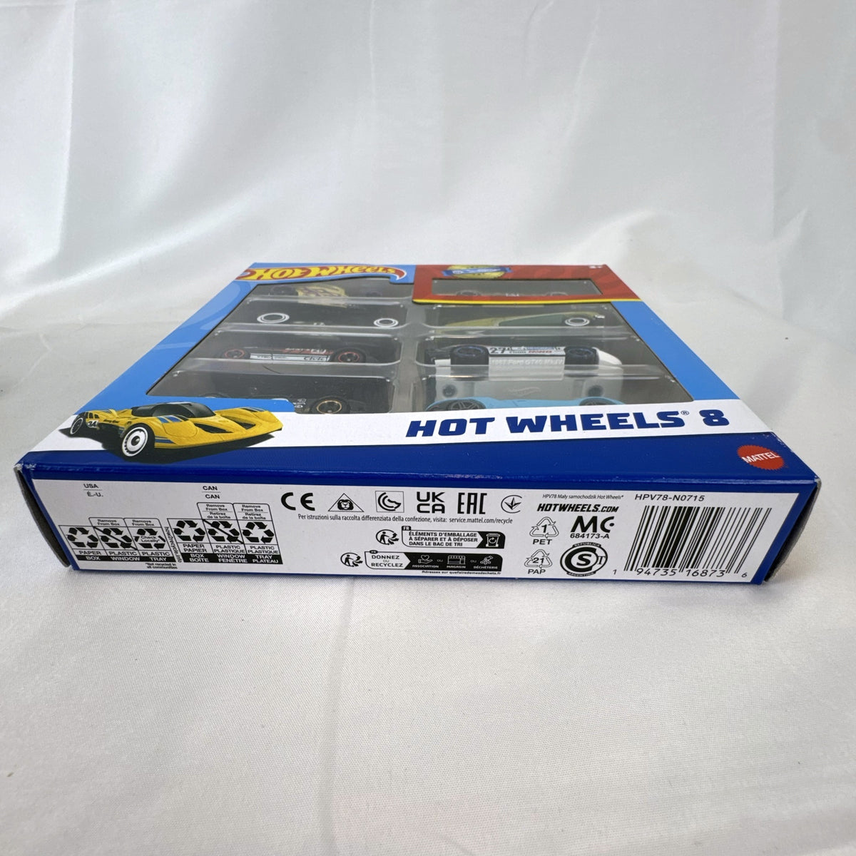Hot Wheels 1:64 scale 8-car multipack in box featuring exclusive gold Nissan Skyline HT 2000GT-X