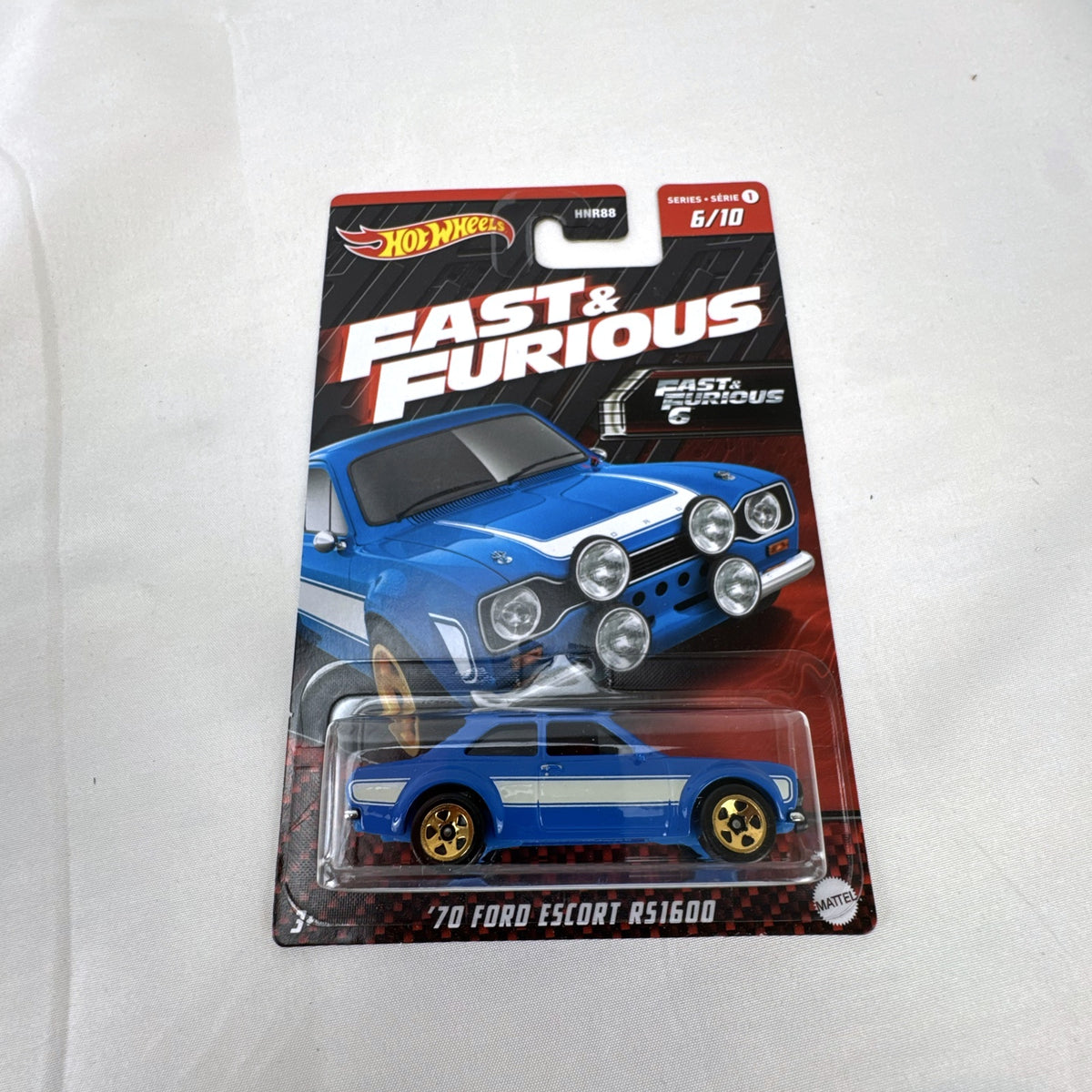 Hot Wheels 1:64 scale 1970 Ford Escort RS1600 diecast car in blue from Fast and Furious, factory sealed