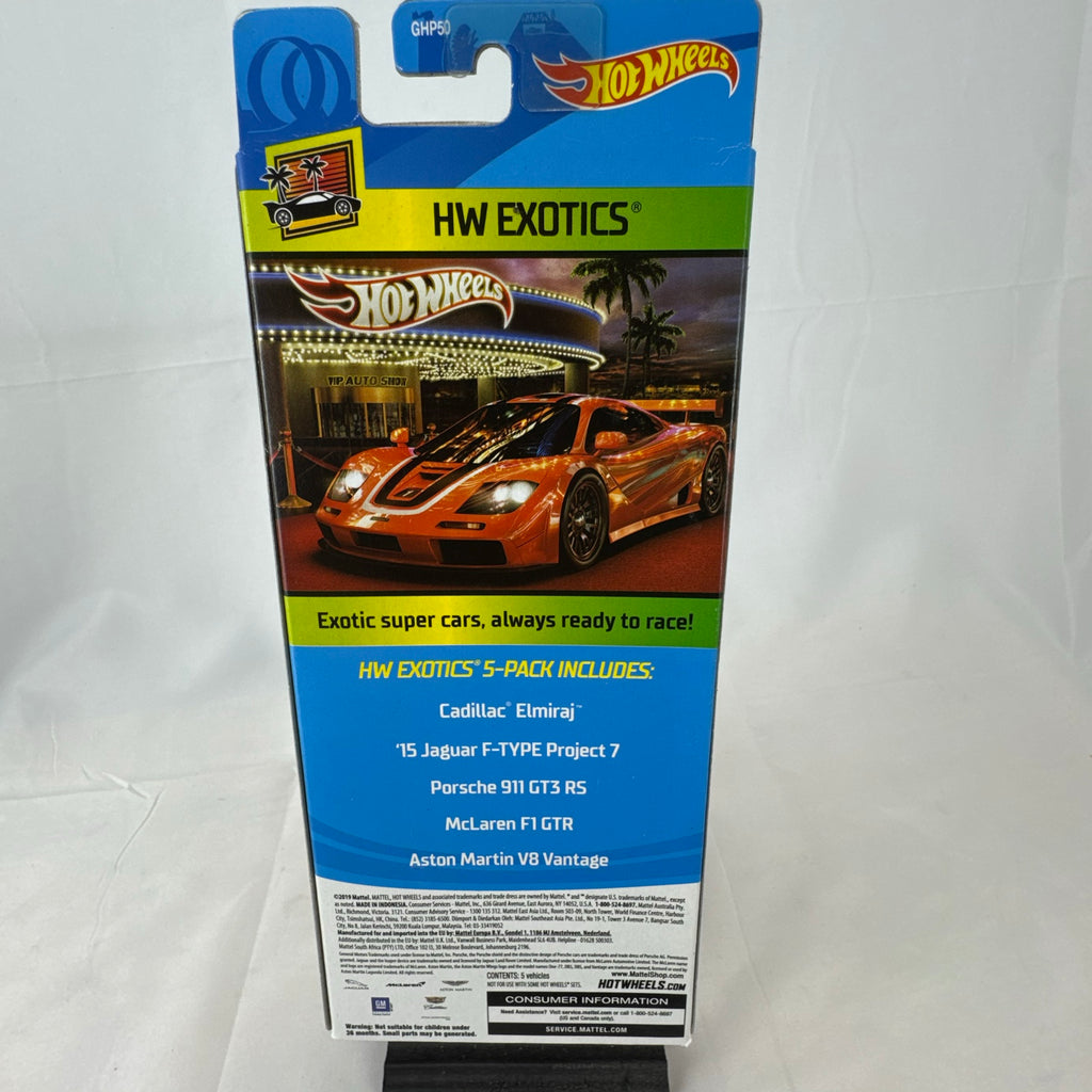 Hot Wheels HW Exotics factory sealed 5-pack set containing McLaren, Porsche, Jaguar, Aston Martin, and Cadillac diecast cars.