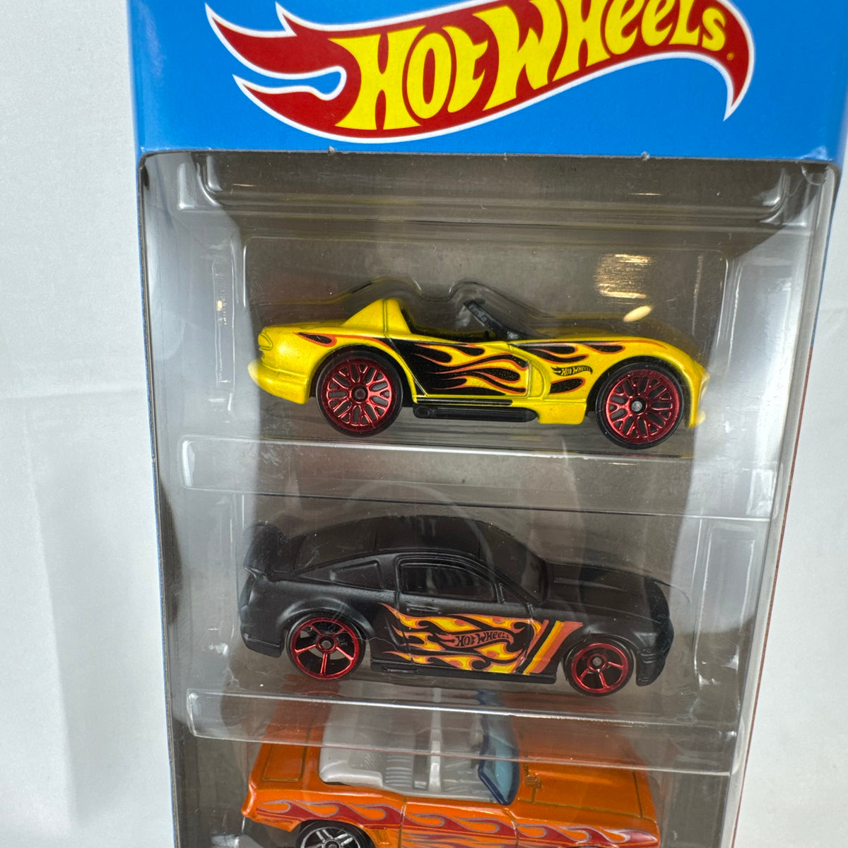 Factory sealed Hot Wheels HW Flames 5-pack 1:64 diecast cars including Mustang, Camaro, Viper, Coronet, and Fairlane.