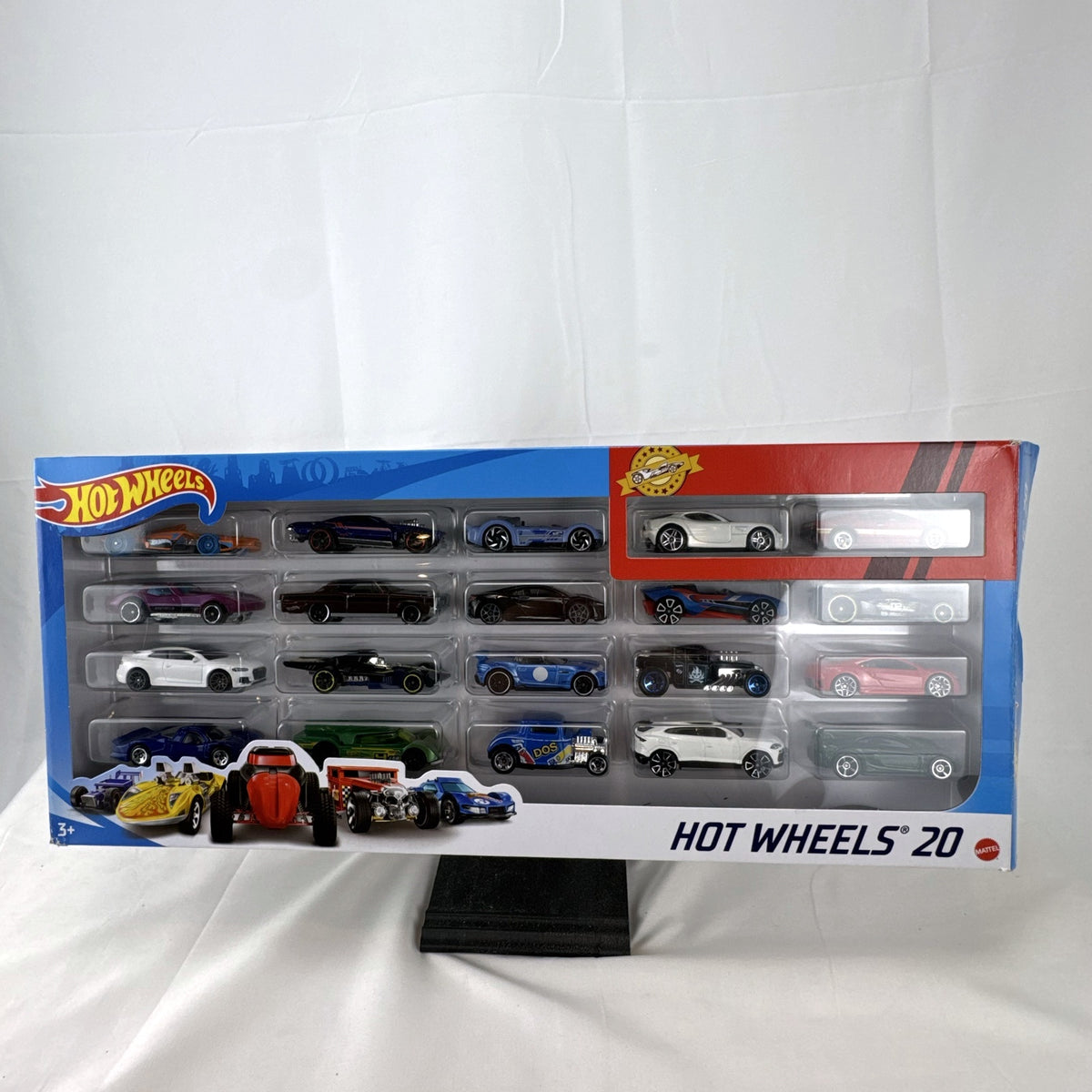 Hot Wheels 20-car diecast 1:64 scale multipack featuring classic muscle cars and modern supercars.
