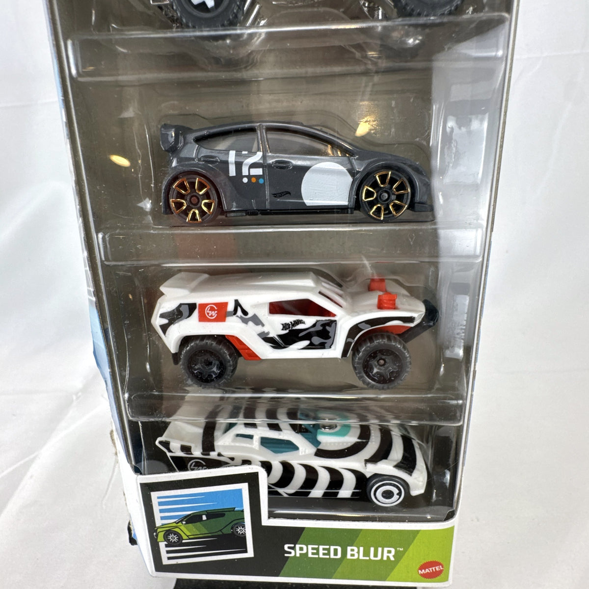 Hot Wheels Speed Blur 5-pack 1:64 scale diecast cars including Ford Mustang, Fiesta, and Jeepster Commando.