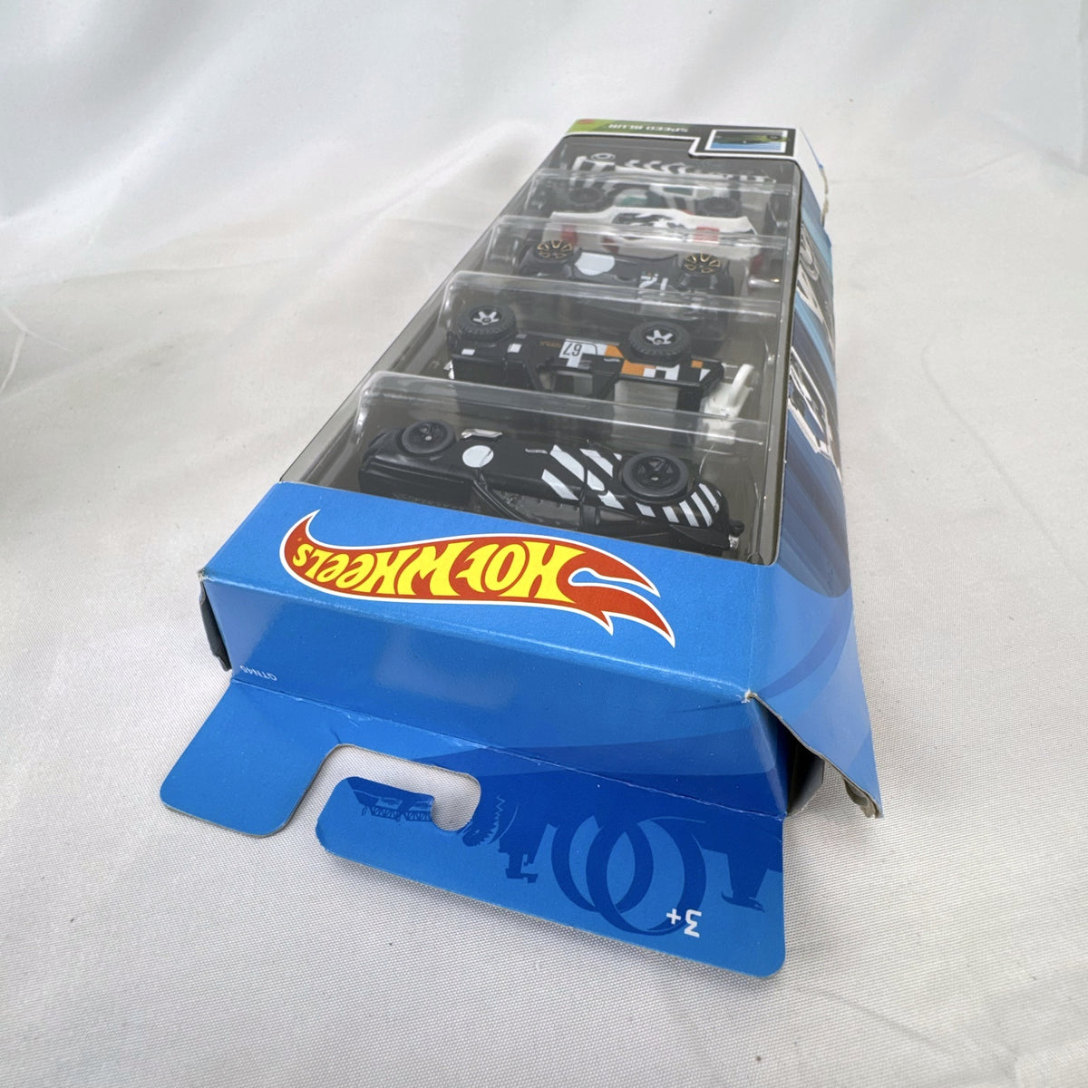 Hot Wheels Speed Blur 5-pack 1:64 scale diecast cars including Ford Mustang, Fiesta, and Jeepster Commando.