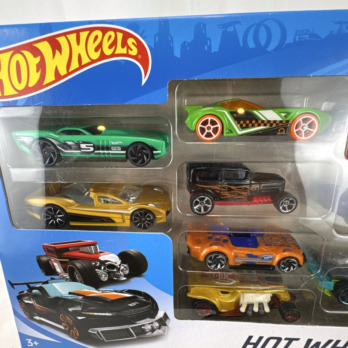 Hot Wheels 9-car boxed gift set including 1:64 scale diecast vehicles and exclusive black Bone Shaker hot rod