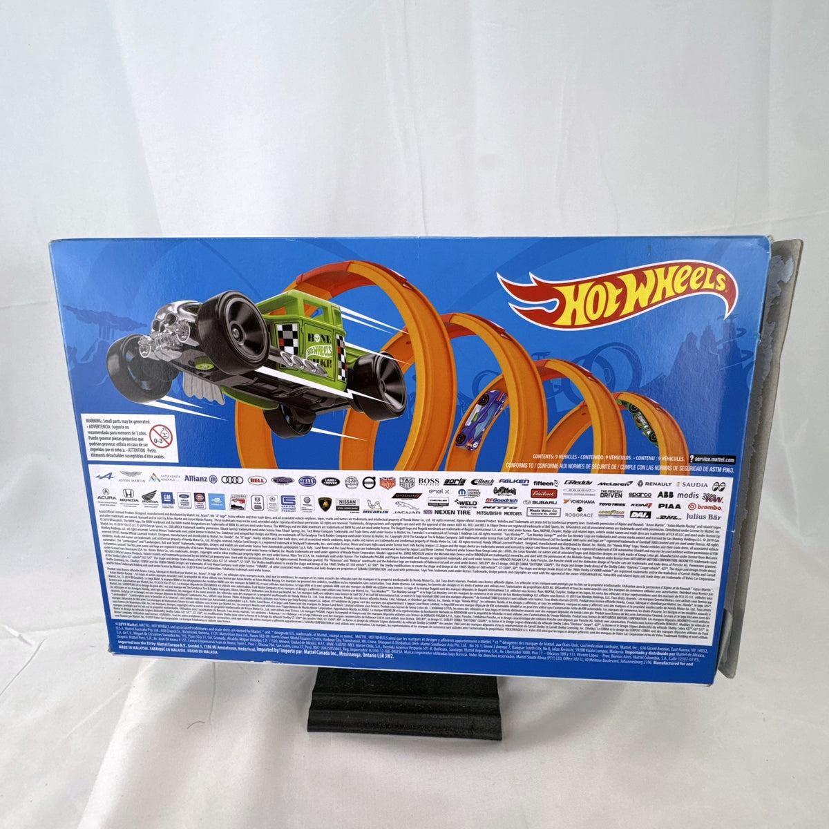 Hot Wheels 1:64 scale 9-car diecast lot including exclusive black '52 Hudson Hornet with flame graphics.