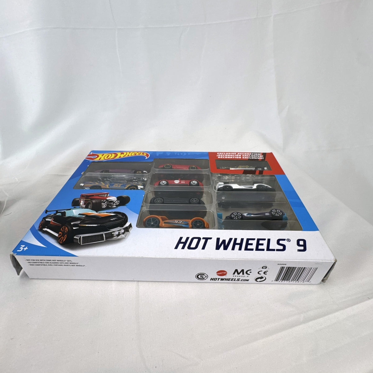 Hot Wheels 1:64 scale 9-car diecast lot including exclusive black '52 Hudson Hornet with flame graphics.