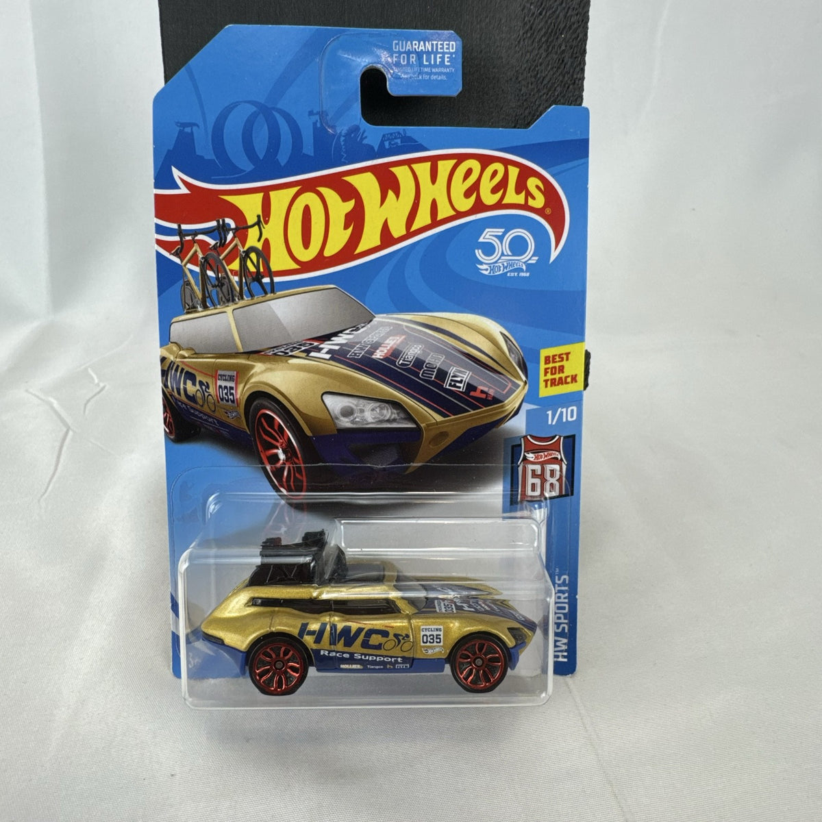 Hot Wheels Tour De Fast 1:64 scale diecast car in metallic gold on original blister card