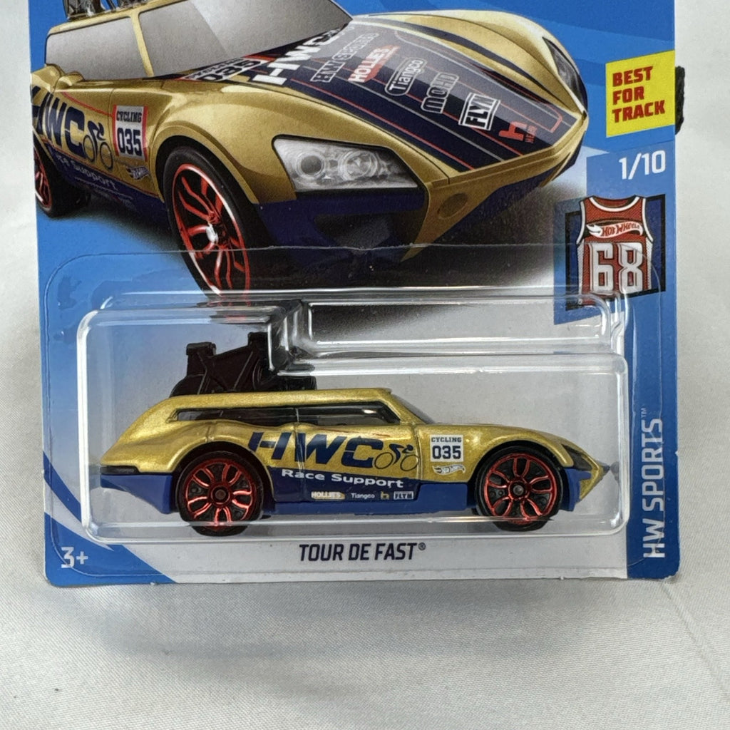 Hot Wheels Tour De Fast 1:64 scale diecast car in metallic gold on original blister card