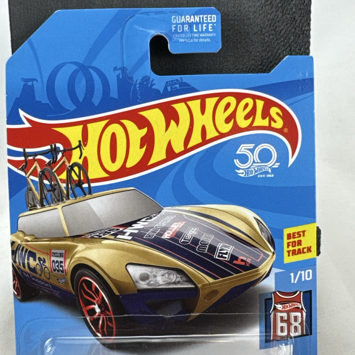 Hot Wheels Tour De Fast 1:64 scale diecast car in metallic gold on original blister card
