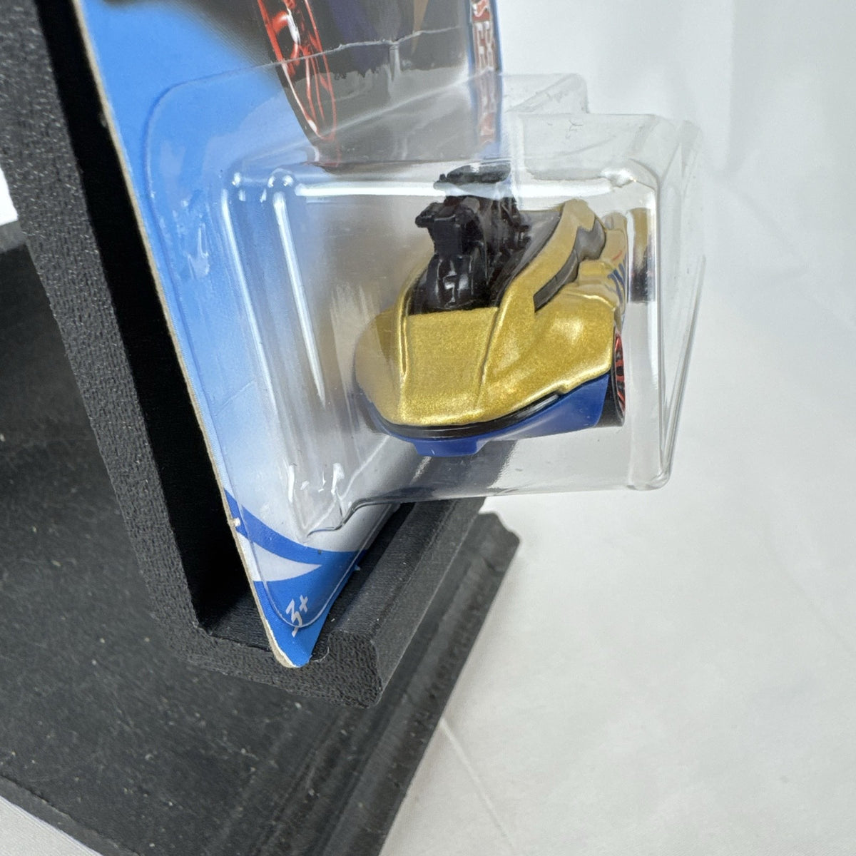 Hot Wheels Tour De Fast 1:64 scale diecast car in metallic gold on original blister card