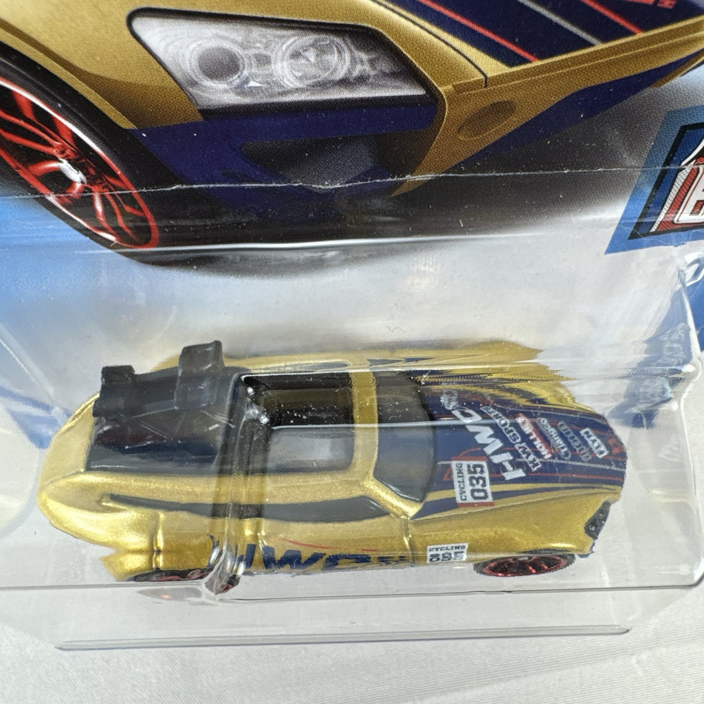 Hot Wheels Tour De Fast 1:64 scale diecast car in metallic gold on original blister card