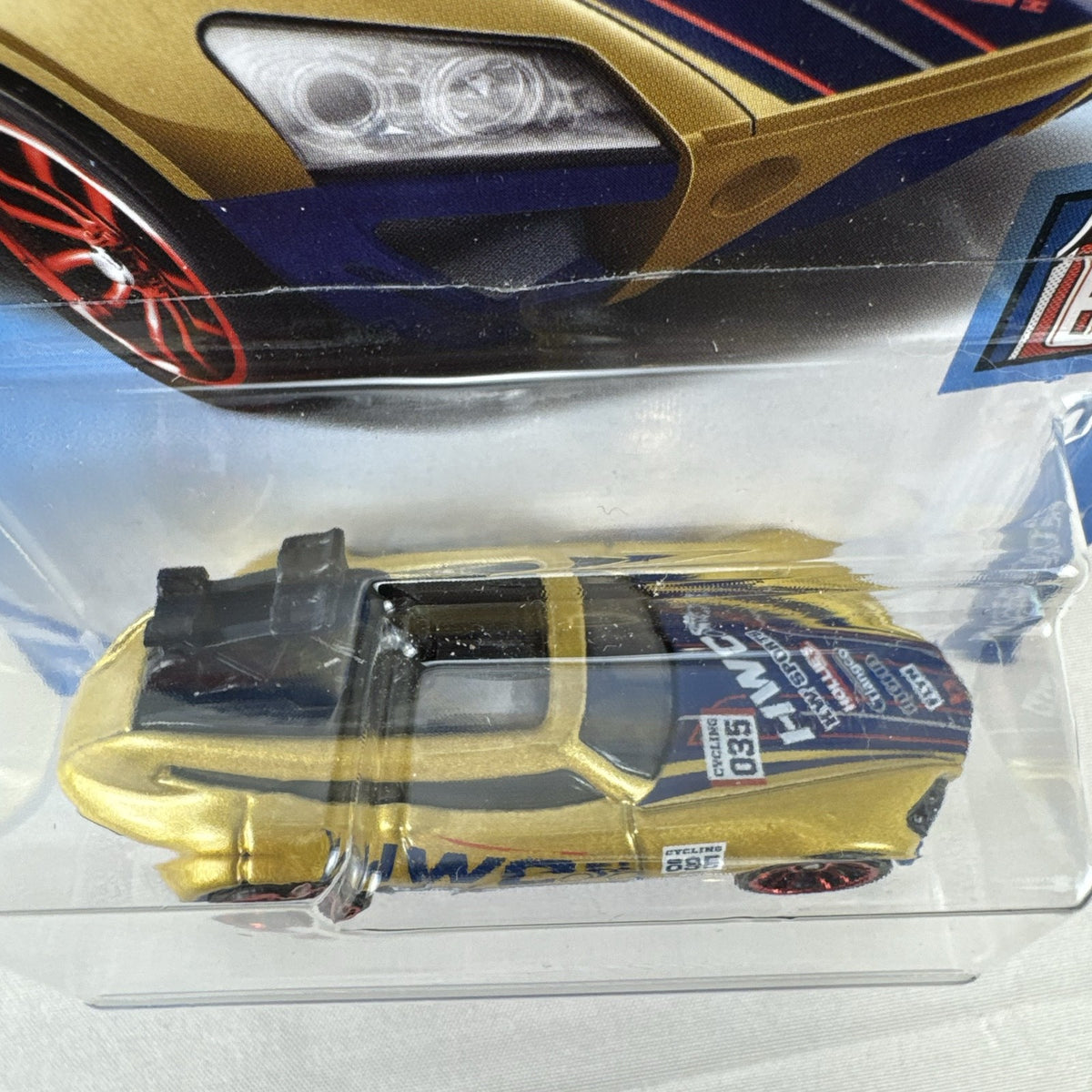 Hot Wheels Tour De Fast 1:64 scale diecast car in metallic gold on original blister card