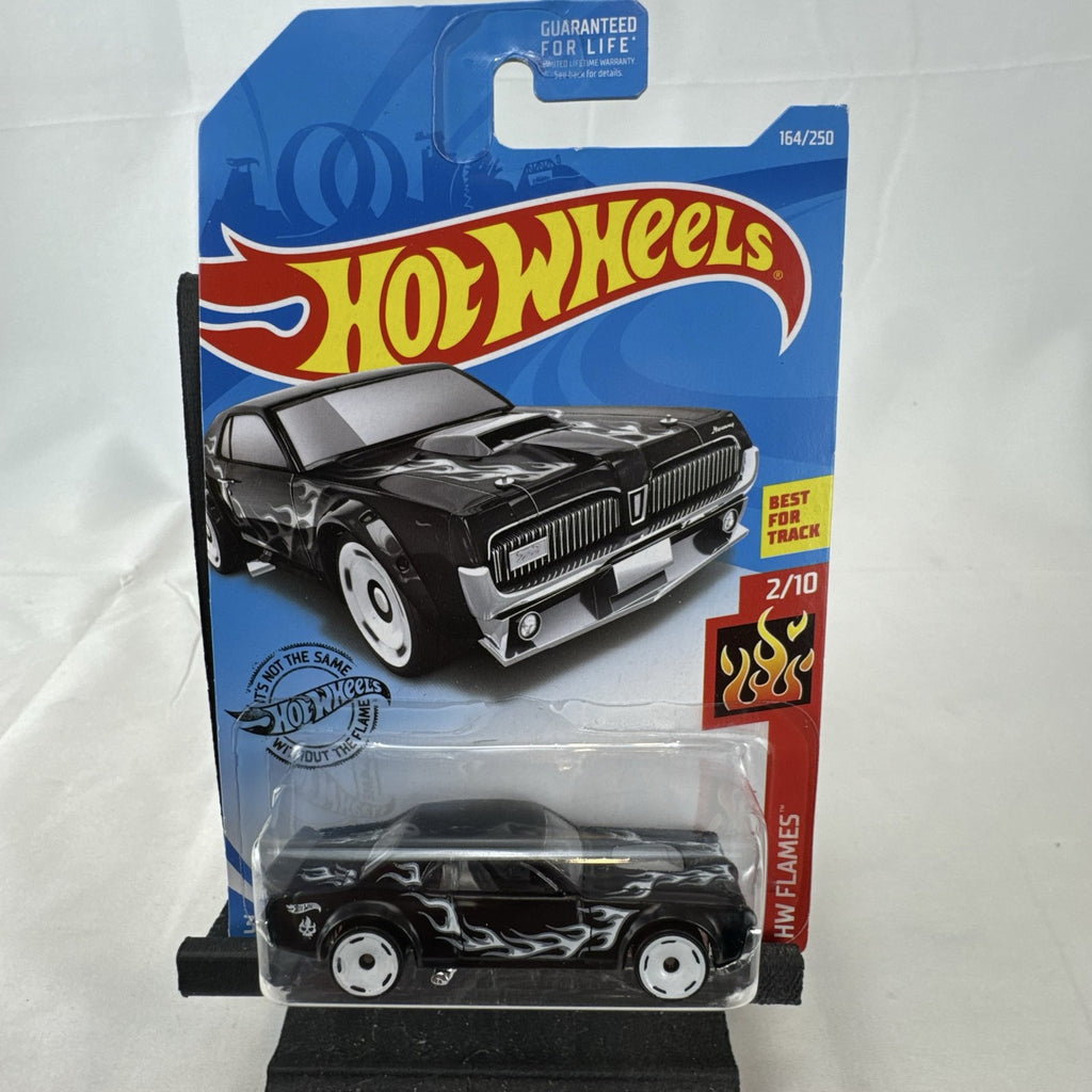 Hot Wheels 1:64 scale diecast 1968 Mercury Cougar in black with silver flame graphics sealed on blister card