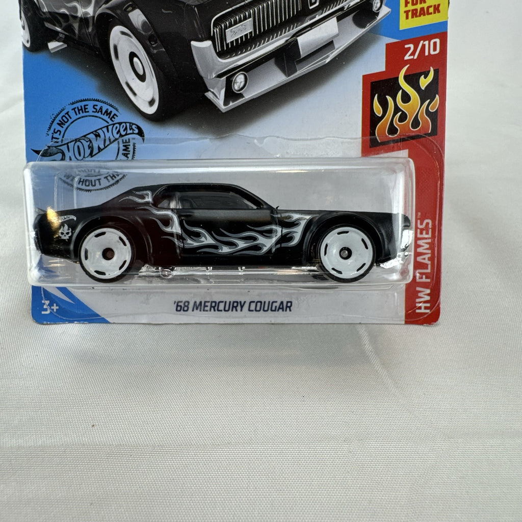 Hot Wheels 1:64 scale diecast 1968 Mercury Cougar in black with silver flame graphics sealed on blister card