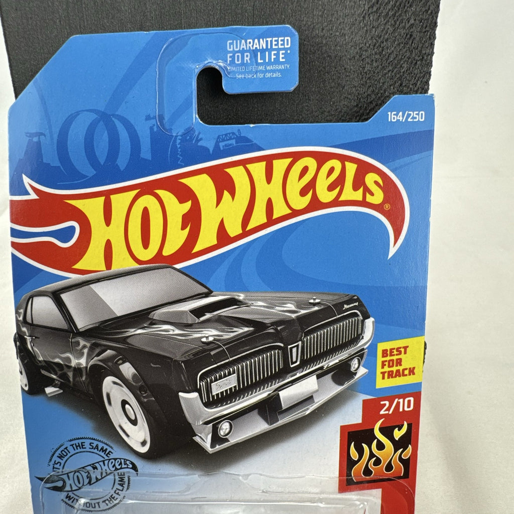 Hot Wheels 1:64 scale diecast 1968 Mercury Cougar in black with silver flame graphics sealed on blister card