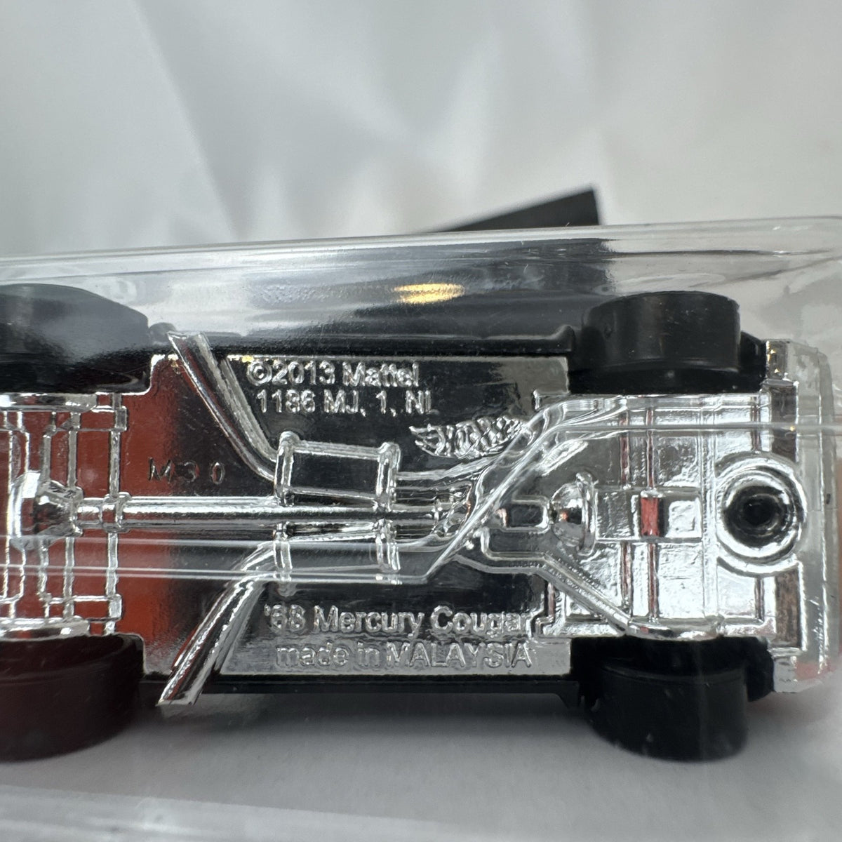 Hot Wheels 1:64 scale diecast 1968 Mercury Cougar in black with silver flame graphics sealed on blister card