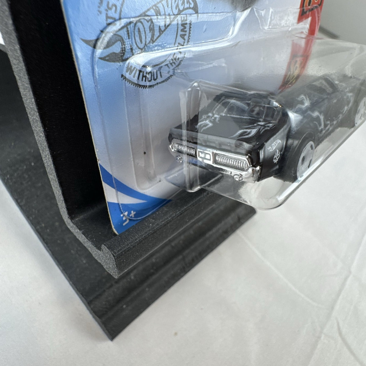 Hot Wheels 1:64 scale diecast 1968 Mercury Cougar in black with silver flame graphics sealed on blister card
