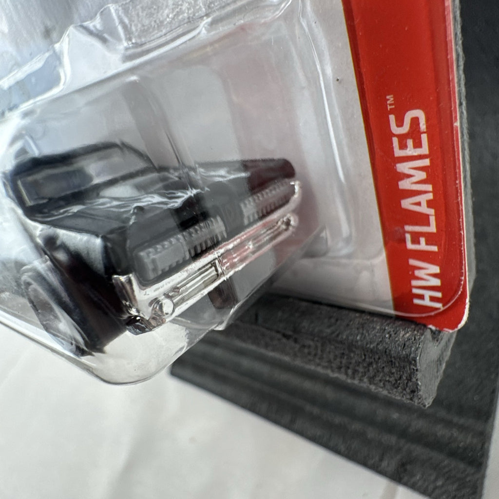 Hot Wheels 1:64 scale diecast 1968 Mercury Cougar in black with silver flame graphics sealed on blister card