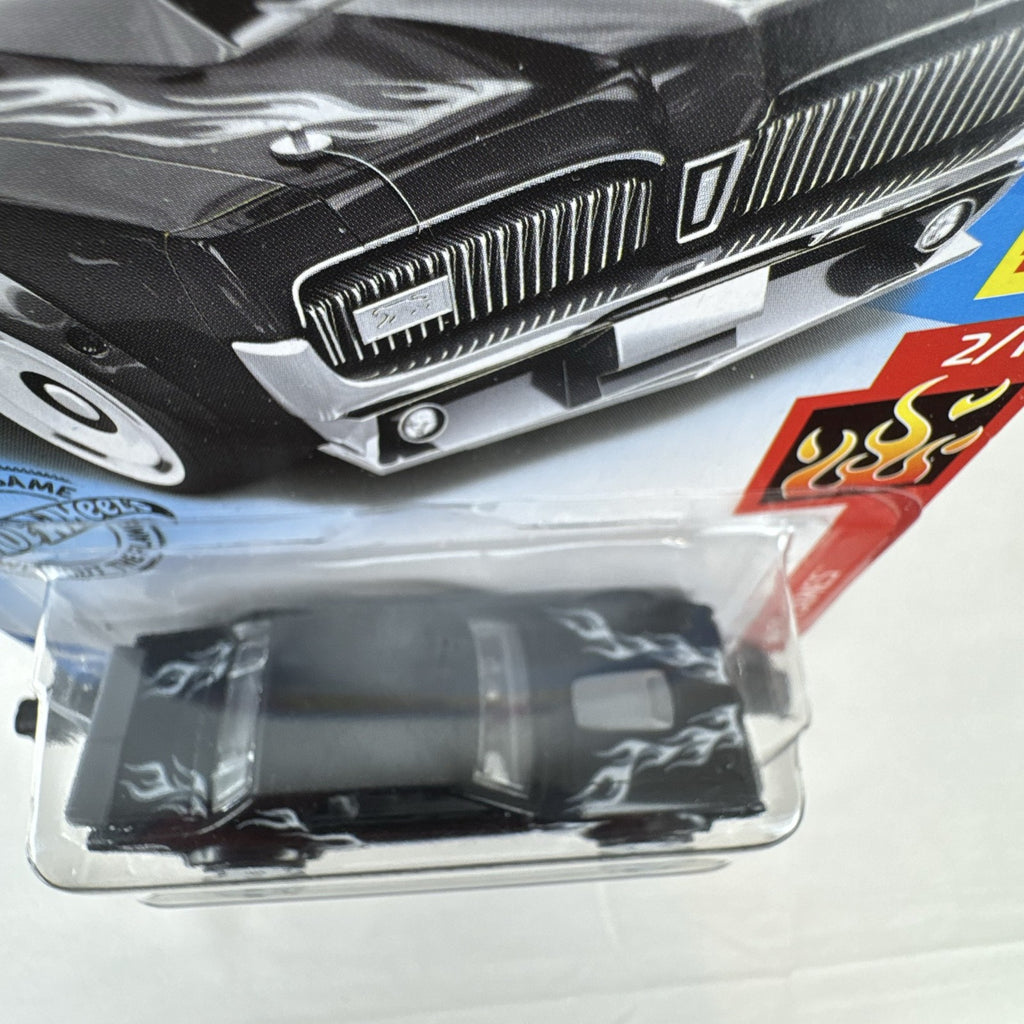 Hot Wheels 1:64 scale diecast 1968 Mercury Cougar in black with silver flame graphics sealed on blister card