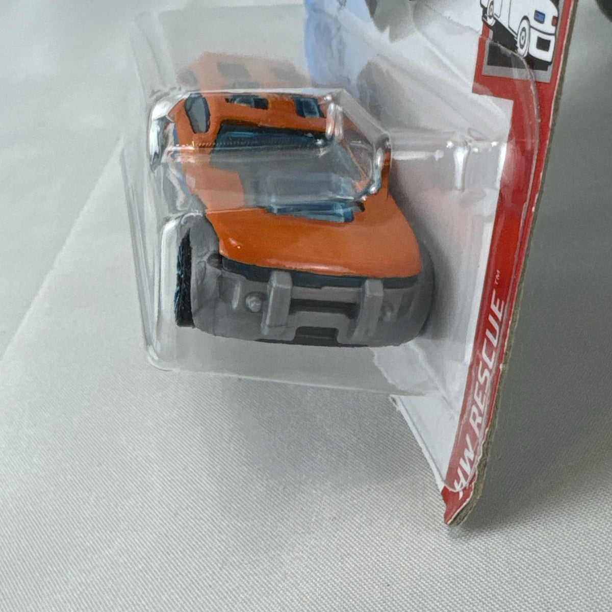 Orange Hot Wheels HW Pursuit 1:64 scale police interceptor diecast car sealed on original card package.
